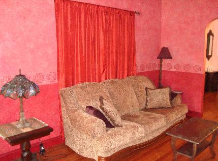 Living Room, North wall.  Curtains cover French Doors to bedroom/office.