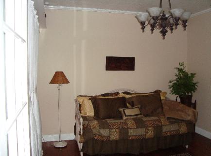 View into bedroom/office off Living Room, facing West.