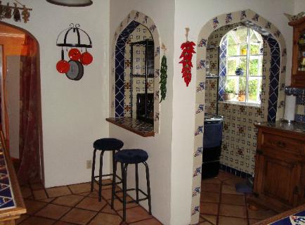 View into Kitchen from Dining Room.  Handpainted Mexican Talavera tile.