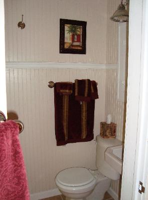 View into Master Bath, beadboard walls.  Tile shower to left.